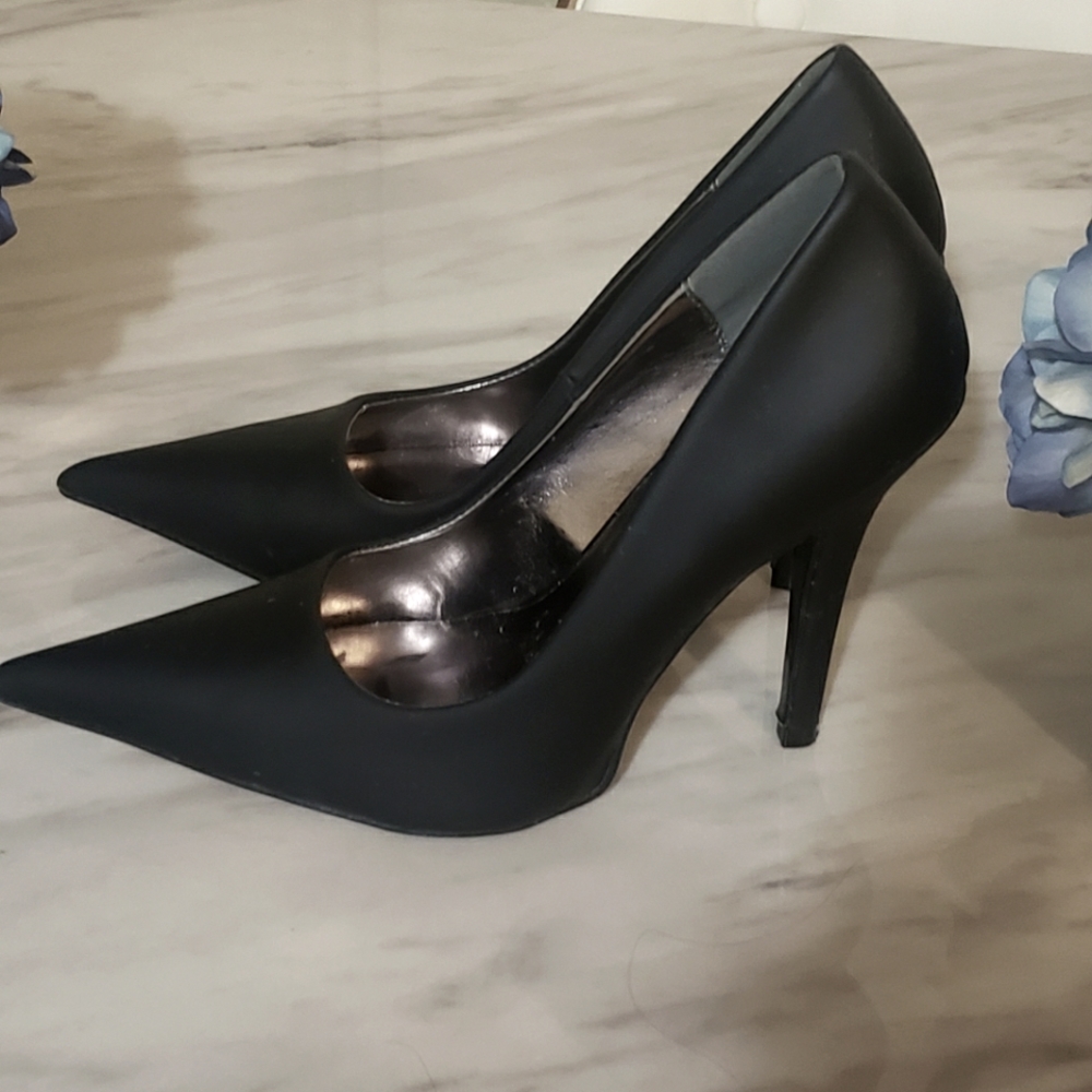 Black pointed high heels